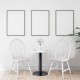 Set of 2 white vintage Windsor wood chairs with spindle back, perfect for dining room use and easy maintenance.